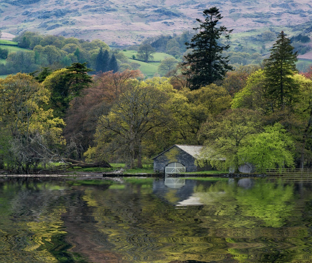 Forest landscape reflected in calm water of Consiton Water 1024x866 1